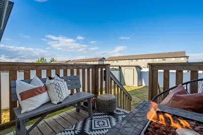 a wooden deck with a bench and a fire grill at The Saturday I Perfect for Families I Arcade Games in Sylvan Lake