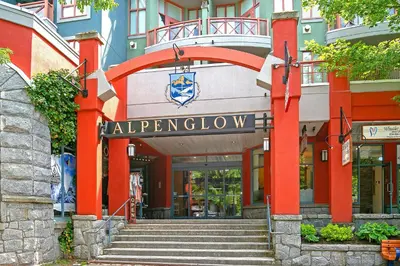 a building with a staircase in front of a building at Alpenglow Lodge Fika One Bedroom by MVA in Whistler