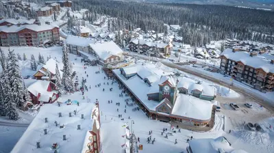 an aerial view of a resort in the snow at Trapper's Lodge - 4 Bd w Great View, Private Hot Tub in Big White