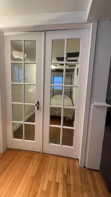 a room with a door leading to a bedroom at walk distance to kits beach 2bedrooms only for you in Vancouver