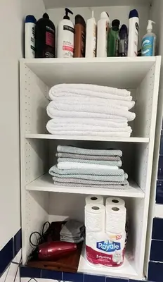 a closet filled with white towels and other items at walk distance to kits beach 2bedrooms only for you in Vancouver