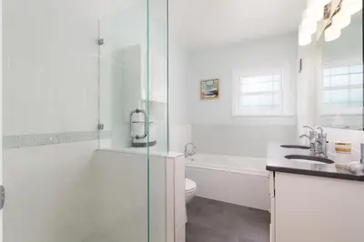 a bathroom with a shower and a toilet and a sink at LOVELY 3 bedroom PORT MOODY spacious home 6 people free parking in Port Moody