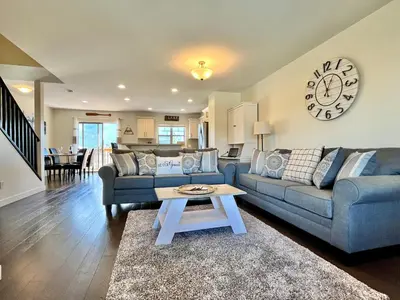 a living room with a couch and a table at Perfect base Invermere 3bd townhouse mt views with garage in Invermere