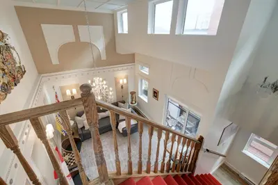 an overhead view of a living room and staircase in a house at Victoria's Parliamentary Suite with Private Rooftop Patio & Harbour View in Victoria