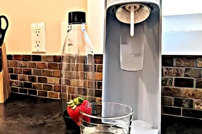 a red bird in a glass bowl in a refrigerator at Waterfront Oasis with Pool, Hot Tub & Pet Friendly in Kelowna