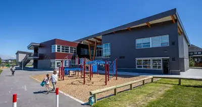 a playground in front of a building at JESI'S NEW HOUSE, Self Enter 2BR, Whole Suite, Close to White Rock Beach & US Border in Surrey