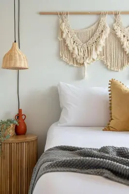 a bedroom with a white bed with a crochet headboard at The Promenade I Patio and BBQ I Fire pit I Sleep 9 in Sylvan Lake