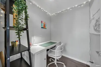 an office with a desk and a chair at Spacious DT 2-BDR High-rise with view, pool, gym in Vancouver