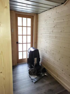 a room with a computer monitor in a room with a window at THE ORCHARD (HOSTEL WITH PRIVATE BUNKS) in Radium Hot Springs