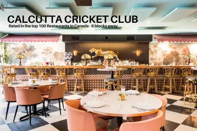 a restaurant with tables and chairs and a bar at LUXURY DT, 2 Bedroom DEAL, Private Balcony, Full Kitchen, Gym - FREE PARKING in Calgary