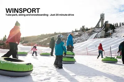 a group of people standing in the snow on a ski slope at LUXURY DT, 2 Bedroom DEAL, Private Balcony, Full Kitchen, Gym - FREE PARKING in Calgary