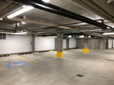 an empty parking lot in a parking garage at Exotic,LUSH,Rainforest,CR,Suite,King,U/G,Wifi in Edmonton