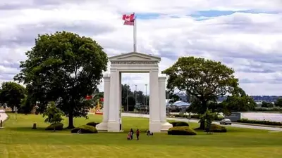 a white arch with a flag on top in a field at Charming, Cheerful, Exquisite 4 BR house, free wifi, free parking, free cancelation in Langley