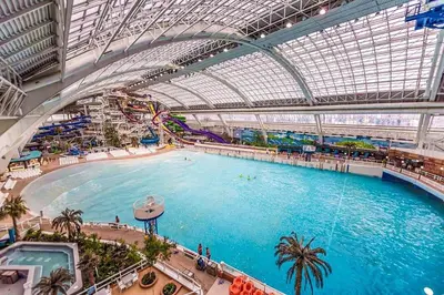 a large indoor swimming pool in a building at Stunning Modern Suite - King Bed - Free Parking & Netflix - Fast Wi-Fi - Long Stays Welcome in Edmonton