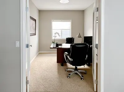 an office with a desk and a chair at Serene and Secure Home Sweet Home with Office, 15 mins to Airport, 20 mins to Downtown, 90 mins to Banff in Calgary