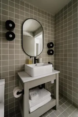 a bathroom with a sink and a mirror at Ski-in/Ski-out Intentionally Designed Ski Lodge in Whistler