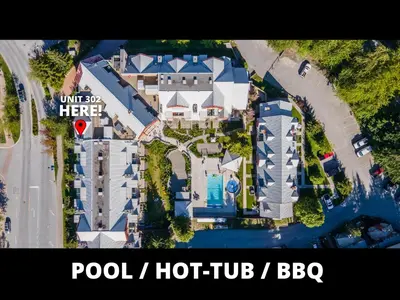 an aerial view of a house with a swimming pool at Ski-in/Ski-out Intentionally Designed Ski Lodge in Whistler