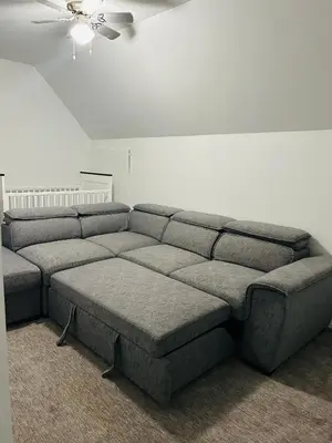 a gray couch in a living room with a ceiling at Spacious & Modern by the Beach in White Rock
