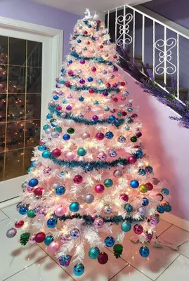 a white christmas tree with colorful ornaments at private single room in a house in Richmond