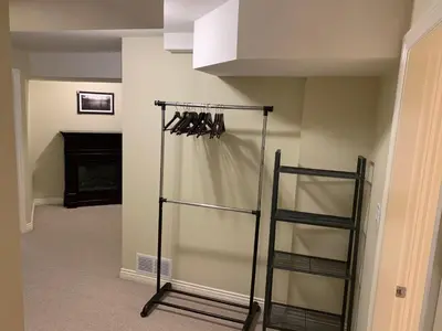 a room with a closet with a glass door at Jimmy B&B in Surrey