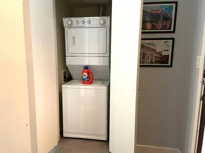 a kitchen with a white refrigerator and a stove at Downtown King Suite-Surround Views-Pool/Gym/Parkng in Vancouver