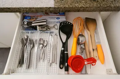 a drawer full of kitchen utensils on a counter at Downtown King Suite-Surround Views-Pool/Gym/Parkng in Vancouver