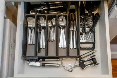 a drawer filled with utensils and forks and spoons at Royal Blue Wild Oasis Corner PNHSE KingBed U/G Wi-fi in Edmonton