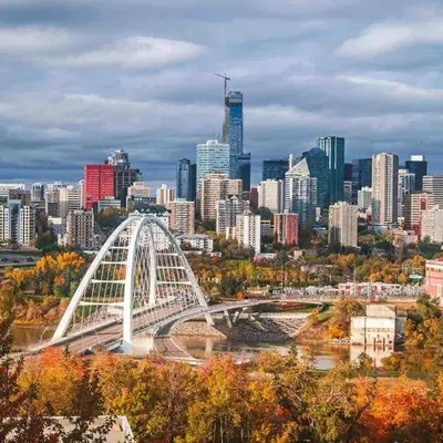 a white bridge in front of a large city at Hot Arabaian NightsCornerPNHSEkingWifiU/G in Edmonton