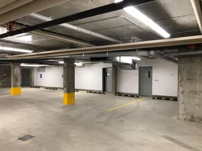 an empty parking lot in an empty parking garage at Hot Arabaian NightsCornerPNHSEkingWifiU/G in Edmonton
