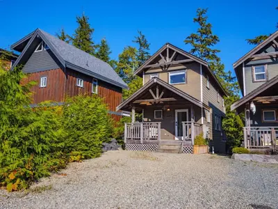 a home with two houses and a barn at The Perch Modern 2 Bed Cabin with Patio and Hot Tub in Ucluelet