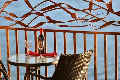 a table with two glasses and a bottle of wine at Salishan Chief Suite by EMR Vacation Rentals in Cowichan Bay