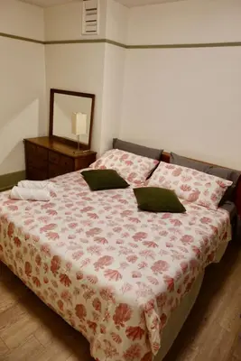 a bedroom with a bed and a dresser at Private room in a Shared house in Vancouver