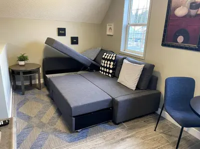 a living room with a couch and a table at Amazing mountain views 1bd Apartment Canmore Banff in Canmore