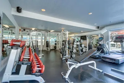 a gym with several treadmills and cardio machines at Chateau Canmore in Canmore