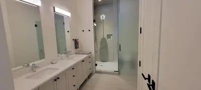 a bathroom with two sinks and a large mirror at Fernie Escape - Mountain Home on the Ski Hill in Fernie