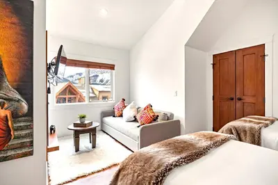 a living room with a bed and a couch at Luxury Penthouse At Solar A Resort And Spa in Canmore
