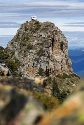 a small house on top of a rocky mountain at Kootenay Lakeview Retreats - Forest Cabin in Nakusp