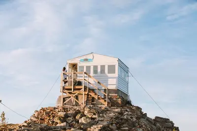a tiny house on top of a pile of rocks at Kootenay Lakeview Retreats - Forest Cabin in Nakusp