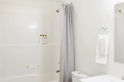 a bathroom with a shower and a toilet and a sink at NN - The Névé - Crestview 1-bed 1-bath in Whitehorse