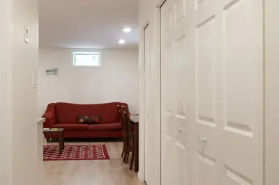 a hallway with a red couch in a room at NN - The Névé - Crestview 1-bed 1-bath in Whitehorse