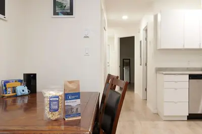 a kitchen table with a bag of food on it at NN - The Névé - Crestview 1-bed 1-bath in Whitehorse