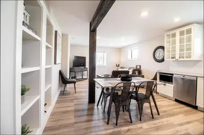 a kitchen and dining room with a table and chairs at NN - Flats on 4th #1 - Downtown 2-bed 2-bath in Whitehorse