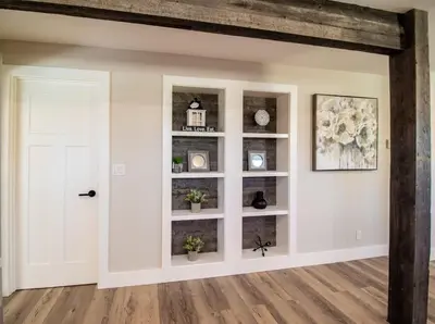 a room with a white wall with shelves at NN - Flats on 4th #1 - Downtown 2-bed 2-bath in Whitehorse