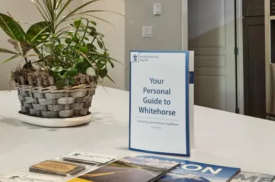 a sign on a table next to a potted plant at NN - Eddy #1 - Whistlebend 3-bed 2 5-bath in Whitehorse