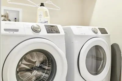 a washing machine and a dryer in a room at NN - Eddy #1 - Whistlebend 3-bed 2 5-bath in Whitehorse