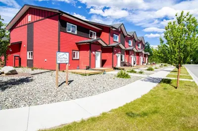 a red building with a sign in front of it at NN - Eddy #1 - Whistlebend 3-bed 2 5-bath in Whitehorse