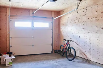 a bike parked next to a garage door at NN - The Kluane - Whistlebend 3-bed 2-bath in Whitehorse