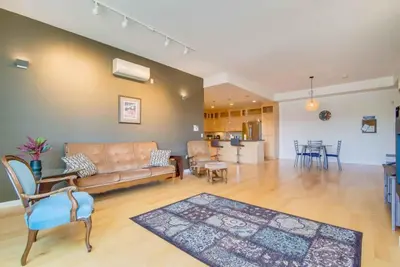 a living room with a couch and a table at NN - Park View #1 - Downtown 2-bed 2-bath in Whitehorse