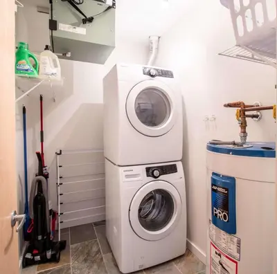 a washer and dryer in a laundry room at NN - Park View #1 - Downtown 2-bed 2-bath in Whitehorse