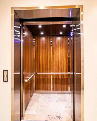 a elevator with wooden doors in a building at NN - Park View #1 - Downtown 2-bed 2-bath in Whitehorse